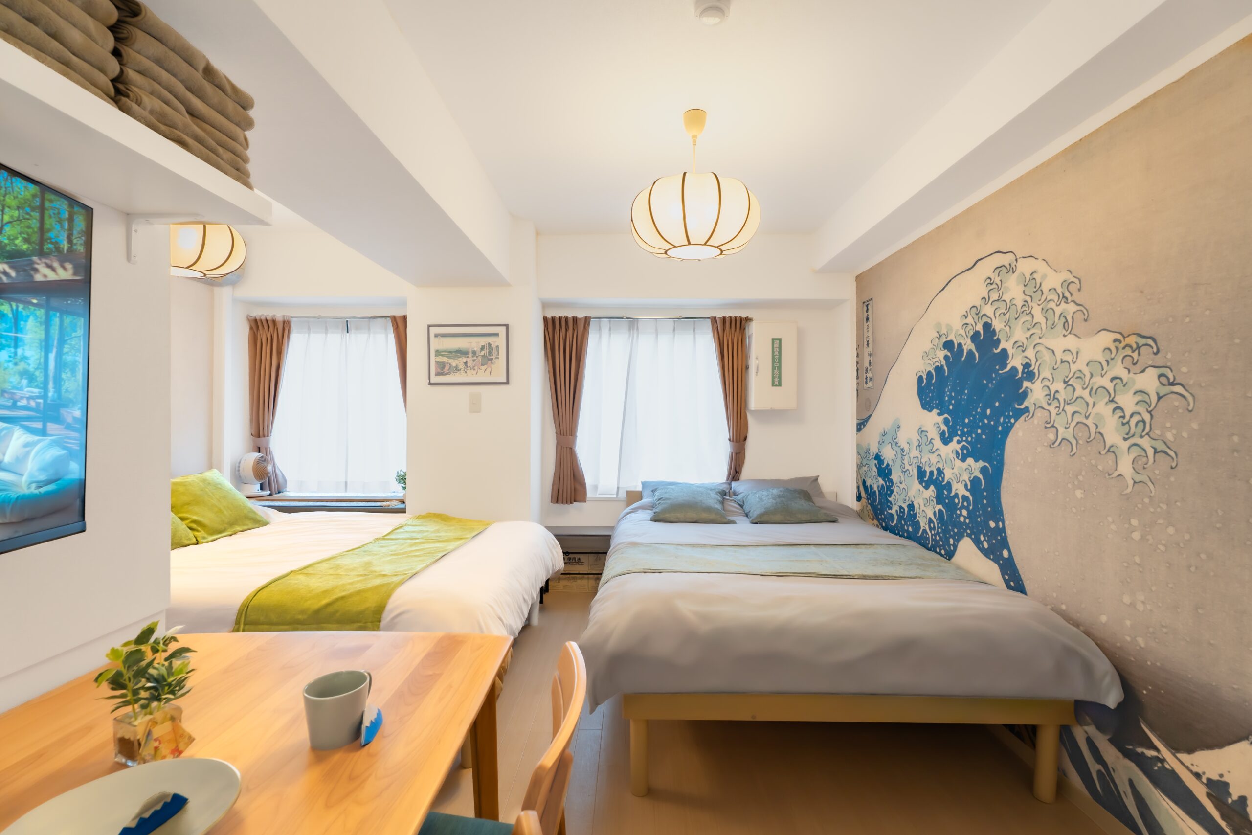 Room — Hokusai Great Wave mural, two beds, lantern