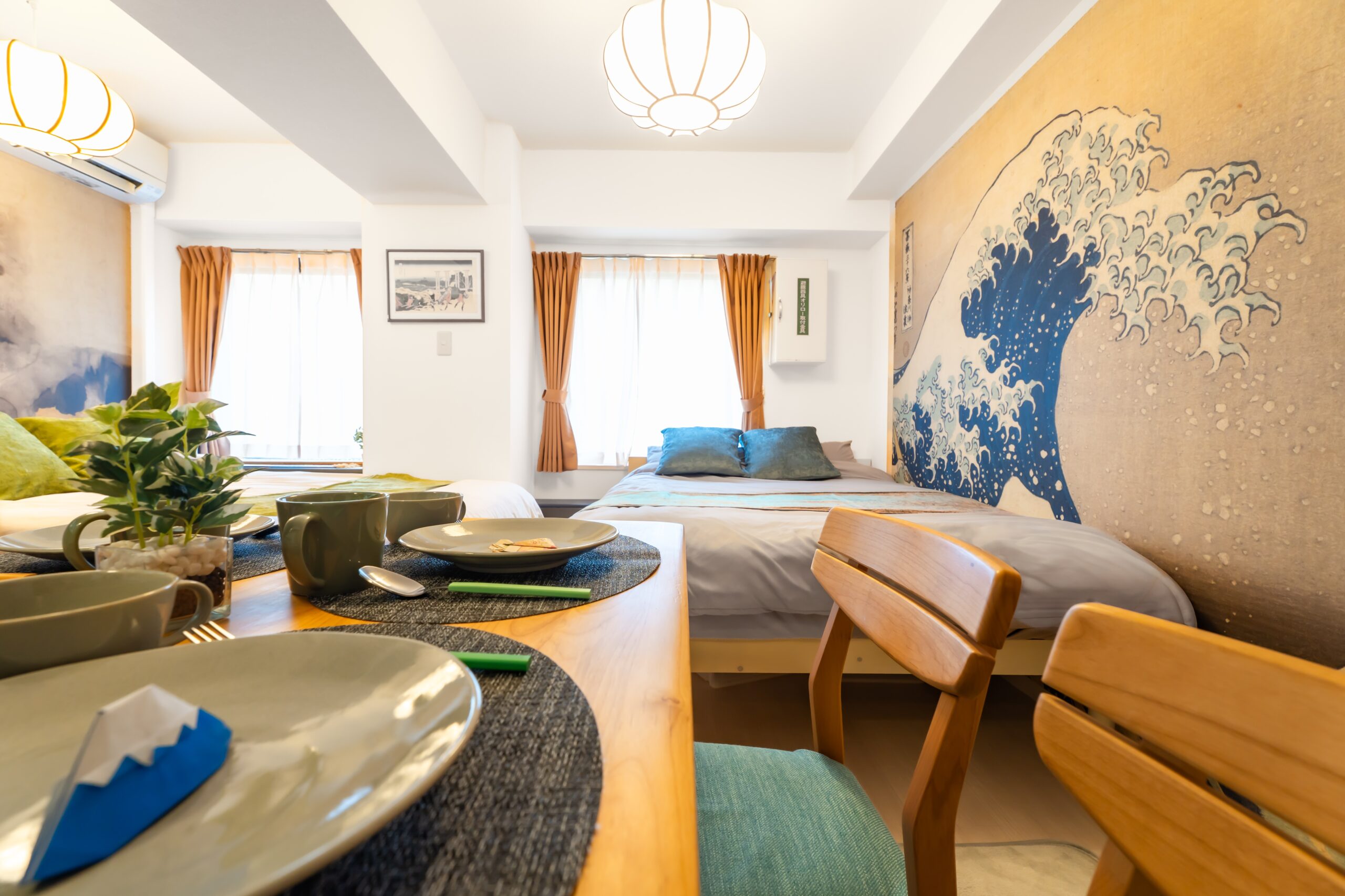 Hokusai wave wall and dining area